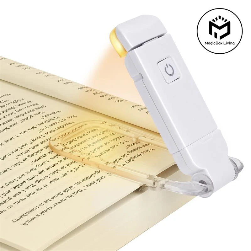 Rechargeable bookmark book light clipped to an open book for reading in bed